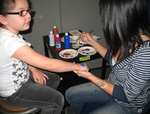 2011 Family Reading Night: Face painting by Illinois Mathematics and Science Academy